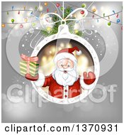 Poster, Art Print Of Christmas Santa Claus Holding Up A Gift In A Bauble Frame Over Gray With Lights