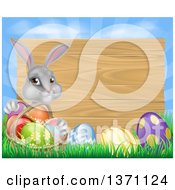 Poster, Art Print Of Gray Easter Bunny Rabbit With Eggs And A Basket In Front Of Blank Wood Sign Against Sky