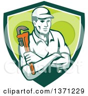 Poster, Art Print Of Retro Male Plumber Holding A Monkey Wrench With Folded Arms In A Green And White Shield