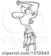 Cartoon Clipart Of A Black And White Naughty Christmas Elf Sitting On A Stool Royalty Free Vector Illustration