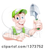 Clipart Of A Happy Middle Aged Brunette White Male Gardener In Green Pointing And Holding A Shovel Royalty Free Vector Illustration