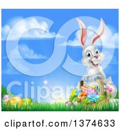 Poster, Art Print Of Happy White Easter Bunny Rabbit With A Basket Of Eggs And Flowers In The Grass With Sky Text Space