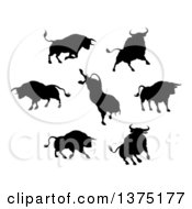 Clipart Of Black Silhouetted Bulls Royalty Free Vector Illustration