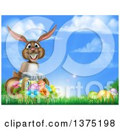 Poster, Art Print Of Happy Brown Easter Bunny With A Basket Of Eggs And Flowers In The Grass Against A Blue Sky