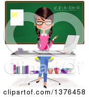 Brunette Caucasian Female Teacher Sitting At A Desk In Front Of A Chalk Board