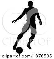 Poster, Art Print Of Black Silhouetted Male Soccer Player Athlete In Action