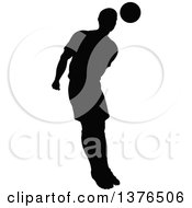 Poster, Art Print Of Black Silhouetted Male Soccer Player Athlete In Action