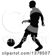 Poster, Art Print Of Black Silhouetted Male Soccer Player Athlete In Action