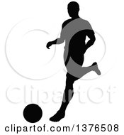 Poster, Art Print Of Black Silhouetted Male Soccer Player Athlete In Action