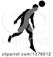 Clipart Of A Black Silhouetted Male Soccer Player Athlete In Action Royalty Free Vector Illustration