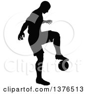 Clipart Of A Black Silhouetted Male Soccer Player Athlete In Action Royalty Free Vector Illustration