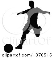 Poster, Art Print Of Black Silhouetted Male Soccer Player Athlete In Action