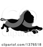 Clipart Of A Black Silhouetted Male Lion Resting Royalty Free Vector Illustration