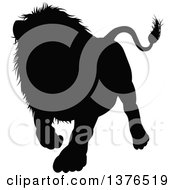 Clipart Of A Black Silhouetted Male Lion Walking Royalty Free Vector Illustration