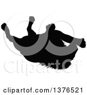 Poster, Art Print Of Black Silhouetted Male Lion Rolling Around On His Back