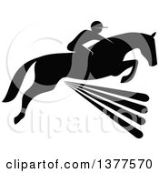 Black And White Silhouetted Rider On A Horse Laping Over A Fence