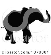 Clipart Of A Black Silhouetted Elephant Walking Royalty Free Vector Illustration