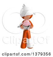 Clipart Of An Injured Orange Man With A Cupcake Royalty Free Illustration