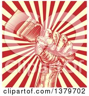 Poster, Art Print Of Retro Woodcut Fist Holding A Paintbrush Over Yellow And Red Rays