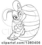 Clipart Of A Black And White Lineart Easter Bunny Leaning Against A Giant Egg Royalty Free Vector Illustration by yayayoyo