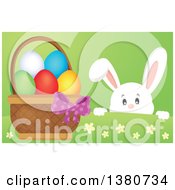 Poster, Art Print Of White Bunny Rabbit Peeking Over A Hill At An Easter Basket Full Of Eggs