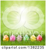Poster, Art Print Of Row Of 3d Easter Eggs In Grass Against A Green Sunburst