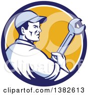 Clipart Of A Retro Male Mechanic Holding A Giant Wrench In A Blue White And Yellow Circle Royalty Free Vector Illustration