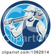 Clipart Of A Retro Male Mechanic Holding A Giant Wrench Over His Shoulder In A Blue And White Circle Royalty Free Vector Illustration