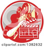 Poster, Art Print Of Retro Male Cameraman Filming And Holding A Clapper In A Red White And Taupe Circle