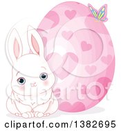 Poster, Art Print Of Cute White Easter Bunny Rabbit Sitting By A Giant Easter Egg With Hearts