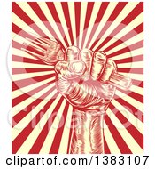 Clipart Of A Retro Woodcut Or Engraved Fisted Hand Holding A Fork Over Beige And Red Rays Royalty Free Vector Illustration by AtStockIllustration