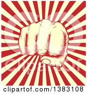 Clipart Of A Retro Woodcut Or Engraved Revolutionary Fist Over Beige And Red Rays Royalty Free Vector Illustration
