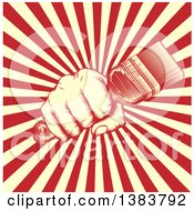 Clipart Of A Retro Woodcut Fist Holding A Paintbrush Over Yellow And Red Rays Royalty Free Vector Illustration
