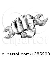 Clipart Of A Black And White Woodcut Or Engraved Fisted Hand Holding A Spanner Wrench Royalty Free Vector Illustration