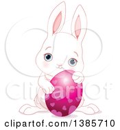 Poster, Art Print Of Cute White Easter Bunny Rabbit Holding An Egg With Hearts