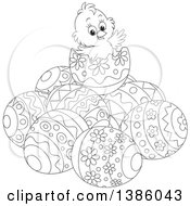 Clipart Of A Black And White Lineart Chick On Top Of A Pile Of Easter Eggs Royalty Free Vector Illustration
