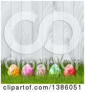 Poster, Art Print Of 3d Easter Eggs In Grass Against A White Wood Fence