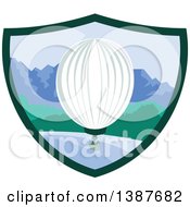 Clipart Of A Retro Hot Air Balloon Over Mountains And The Ocean In A Shield Royalty Free Vector Illustration