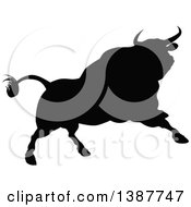 Clipart Of A Silhouetted Black Bull Charging Royalty Free Vector Illustration