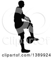 Poster, Art Print Of Black Silhouetted Male Soccer Player In Action