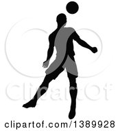 Clipart Of A Black Silhouetted Male Soccer Player Heading A Ball Royalty Free Vector Illustration
