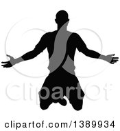 Poster, Art Print Of Black Silhouetted Male Soccer Player Kneeling Or Jumping