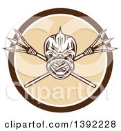 Clipart Of A Retro Tribal Skull Of Dorado Dolphin Fish Mahi Mahi Over Crossed Primitive Spears In A Brown White And Beige Circle Royalty Free Vector Illustration