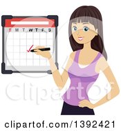 Brunette White Girl Checking Off A Date On A Calendar