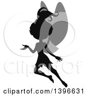 Clipart Of A Black Silhouetted Flying And Presenting Female Fairy With Gray Wings Royalty Free Vector Illustration