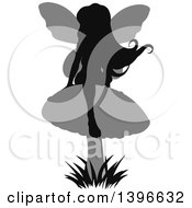 Clipart Of A Black Silhouetted Female Fairy With Gray Wings Sitting On A Mushroom Royalty Free Vector Illustration