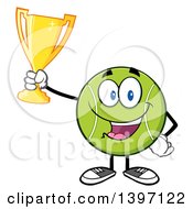 Cartoon Happy Tennis Ball Character Mascot Holding Up A Trophy