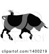 Clipart Of A Silhouetted Black Bull Charging Royalty Free Vector Illustration