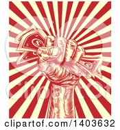 Clipart Of A Retro Engraved Revolutionary Fist Holding Money Over A Red And Yellow Burst Royalty Free Vector Illustration