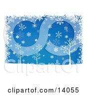 Winter Snowflakes Falling Over Bare Trees On A Blue Background